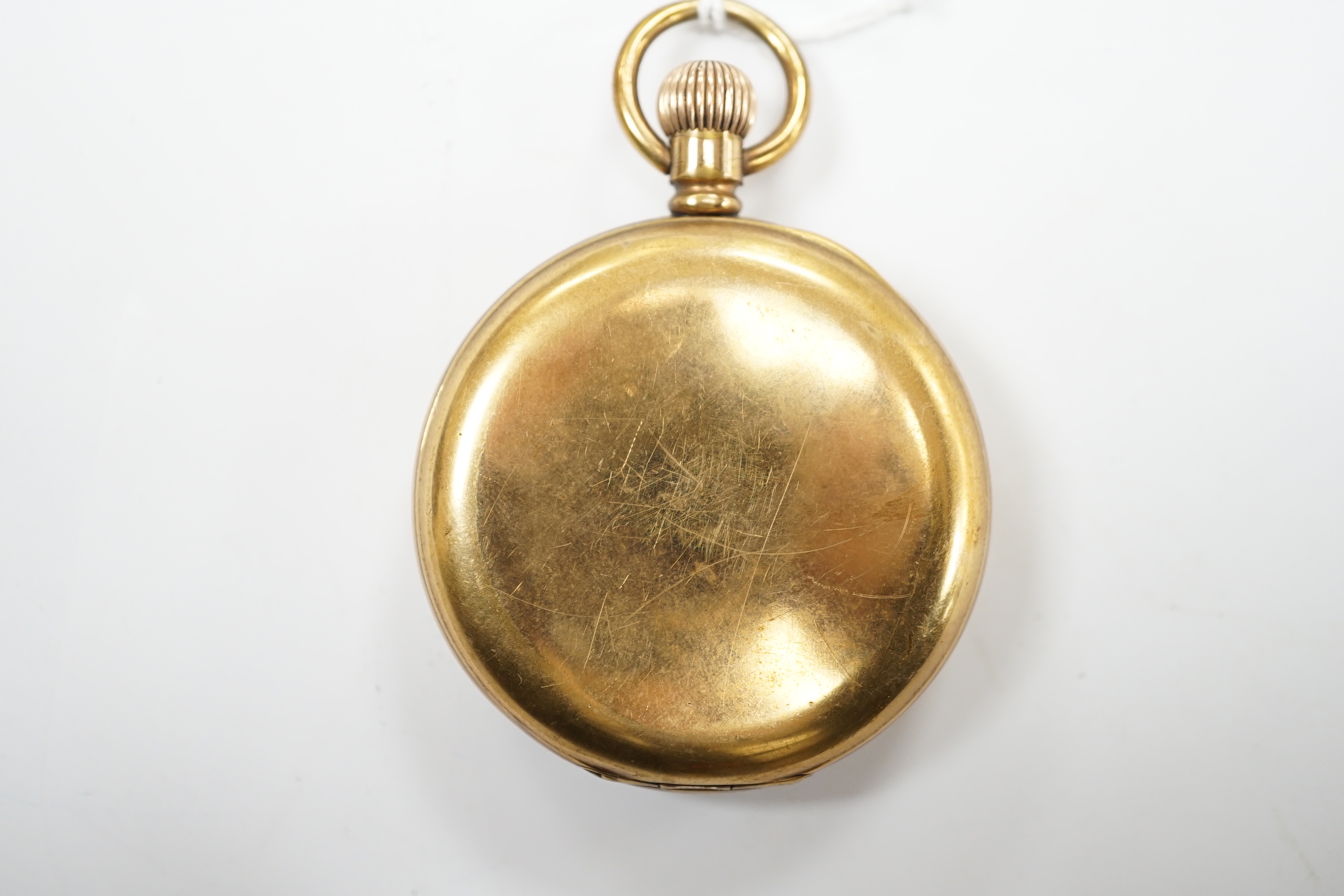 A gold plated Rolex open face keyless pocket watch, with black dial and white Arabic numerals, case diameter 50mm.